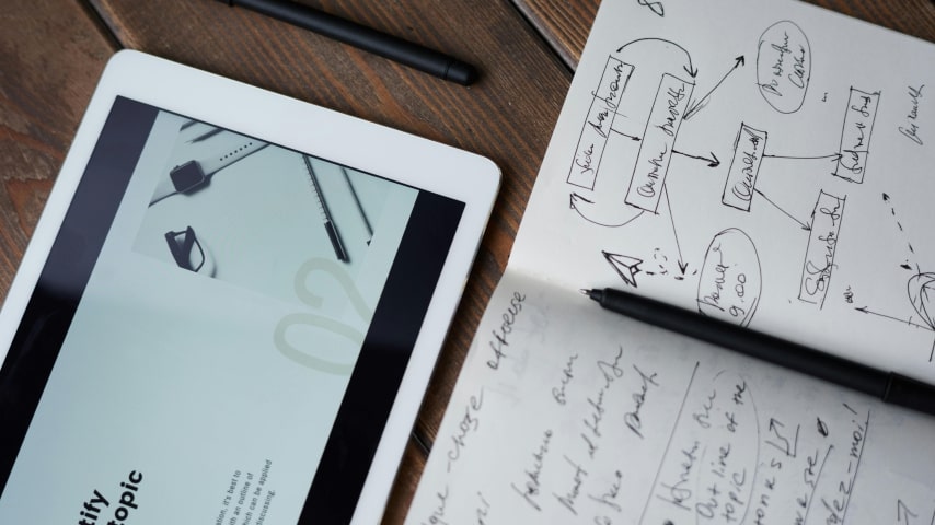 Market your online store A notebook with written marketing materials.