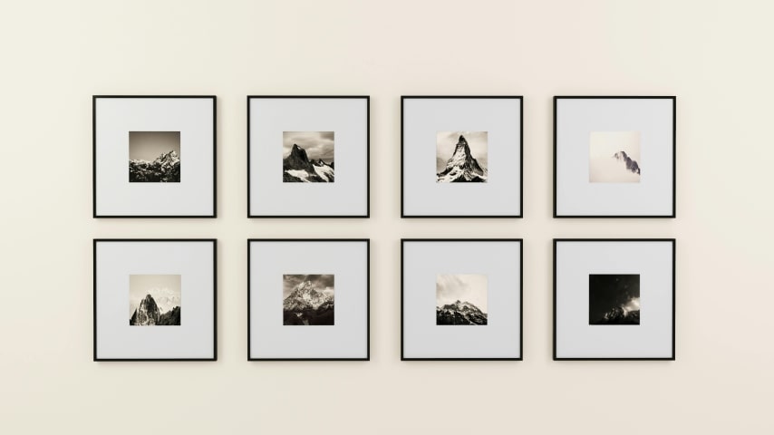 Sell Art on Shopify With Print on Demand A wall with printed artwork.